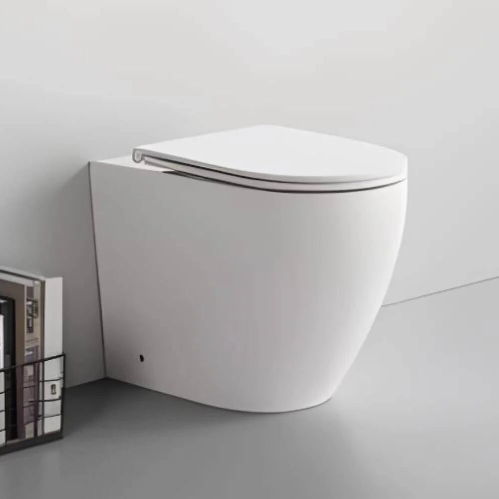 TAURUS | WC a terra filo muro con scarico Vortex