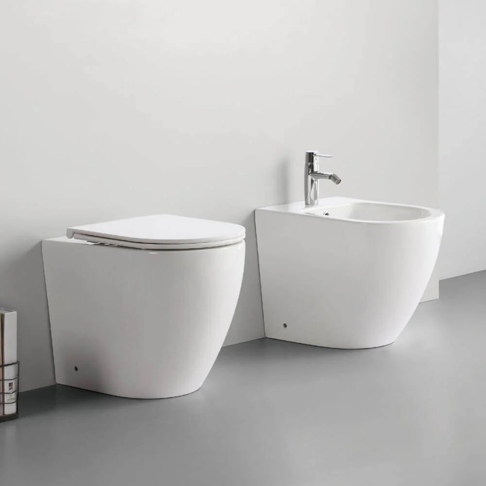 TAURUS | Set sanitari a terra filo muro con scarico Vortex